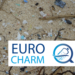 pieces of plastic on a beach with EUROqCHARM logo on photo