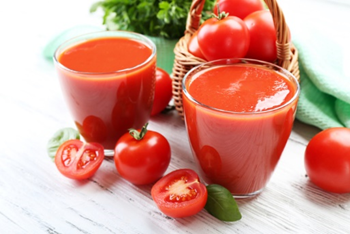 Tomatoes and fresh red tomato juice