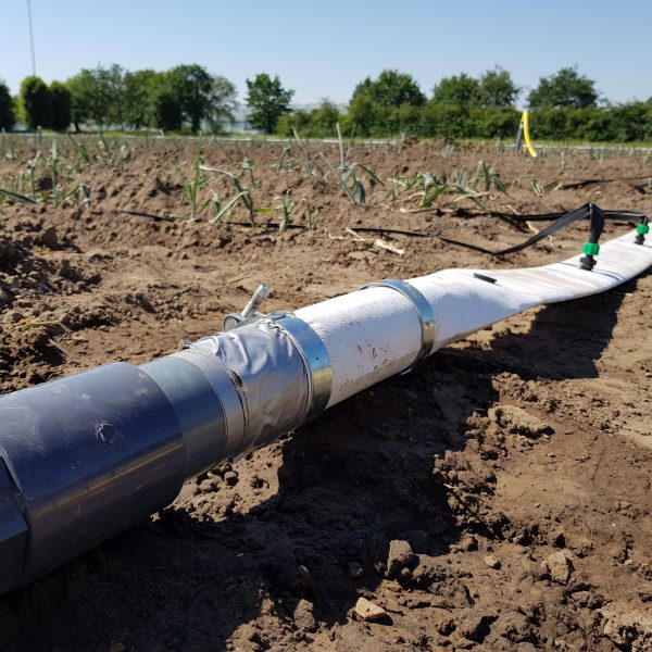 flexible irrigation pipe on a field